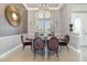 Chic dining room with a stylish chandelier, elegant decor, and comfortable seating arrangements at 442 Flora Creek Ct, Lake Mary, FL 32746