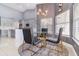 Contemporary dining area with modern chairs, a sleek table, and stylish decor accents at 442 Flora Creek Ct, Lake Mary, FL 32746