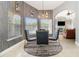 Dining room features modern lighting, a glass table with four chairs, and a large window with natural light at 442 Flora Creek Ct, Lake Mary, FL 32746
