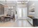 Elegant entryway with high ceilings, striking chandelier, and decorative console table at 442 Flora Creek Ct, Lake Mary, FL 32746