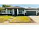 Charming single-story home featuring a well-manicured lawn and a two-car garage, plus a columned entry at 442 Flora Creek Ct, Lake Mary, FL 32746