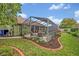 Fully-enclosed pool and patio area visible from the landscaped backyard at 1002 Ohanlon Ct, Oviedo, FL 32765