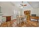 Charming dining area with rustic wooden furniture and natural light from the window at 1002 Ohanlon Ct, Oviedo, FL 32765