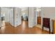 Hallway leads to bedrooms and bathrooms with doors open to view the spaces at 1002 Ohanlon Ct, Oviedo, FL 32765