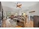 Spacious living room with tile floors, vaulted ceilings, and sliding glass doors at 1002 Ohanlon Ct, Oviedo, FL 32765