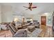 Comfortable living room featuring neutral furniture, fireplace, and tile flooring at 1002 Ohanlon Ct, Oviedo, FL 32765