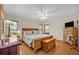 Spacious main bedroom features wood floors, a ceiling fan, and lots of natural light at 1002 Ohanlon Ct, Oviedo, FL 32765