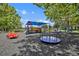 Local community playground with swings, a slide and covered picnic tables at 1002 Ohanlon Ct, Oviedo, FL 32765