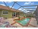 Sparkling pool and backyard, framed by a screened enclosure, offering a perfect oasis for relaxation at 1002 Ohanlon Ct, Oviedo, FL 32765