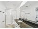 Bright bathroom with walk-in shower, modern sink, and contemporary fixtures at 1195 Boardwalk Pl, Kissimmee, FL 34747