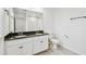 Bathroom featuring granite counters, dual sinks, and a toilet at 1195 Boardwalk Pl, Kissimmee, FL 34747