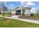 Charming community clubhouse featuring stone accents, blue siding, and a welcoming entrance at 1195 Boardwalk Pl, Kissimmee, FL 34747
