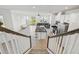 View from the stairs looking into the open concept kitchen and living room space at 1195 Boardwalk Pl, Kissimmee, FL 34747