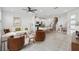 Bright open-concept living room and kitchen with tiled floors and modern furnishings; great for entertaining at 1195 Boardwalk Pl, Kissimmee, FL 34747