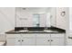 Main bathroom with double sinks, granite countertops, and modern fixtures at 1195 Boardwalk Pl, Kissimmee, FL 34747