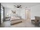 Bright and serene main bedroom with a large bed, modern ceiling fan, and ample closet space at 1195 Boardwalk Pl, Kissimmee, FL 34747