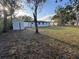 Spacious backyard featuring a storage shed and lush grass at 1289 E Hancock Dr, Deltona, FL 32725