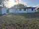 Well-maintained backyard featuring a storage shed and partial grass with tree coverage at 1289 E Hancock Dr, Deltona, FL 32725