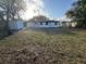 Spacious backyard with a storage shed, partial grass, and tree coverage at 1289 E Hancock Dr, Deltona, FL 32725