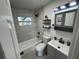 Renovated bathroom featuring a tub, updated vanity, and contemporary finishes at 1289 E Hancock Dr, Deltona, FL 32725