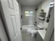 Updated bathroom with modern fixtures, stylish tile, and a shower-tub combination at 1289 E Hancock Dr, Deltona, FL 32725