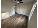 Bedroom with modern wood-look floors and a large closet for ample storage, with plenty of natural light at 1289 E Hancock Dr, Deltona, FL 32725