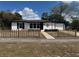 Charming single-story home features fresh paint, decorative lawn decor, and well-maintained front yard at 1289 E Hancock Dr, Deltona, FL 32725