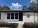 Charming single-story home features fresh paint, decorative lawn decor, and well-maintained front yard at 1289 E Hancock Dr, Deltona, FL 32725