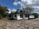 Charming single-story home features fresh paint, decorative lawn decor, and well-maintained front yard at 1289 E Hancock Dr, Deltona, FL 32725