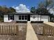 Charming single-story home features fresh paint, decorative lawn decor, and well-maintained front yard at 1289 E Hancock Dr, Deltona, FL 32725