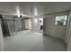 Spacious garage with painted walls and floors, offering access to the kitchen and laundry areas at 1289 E Hancock Dr, Deltona, FL 32725