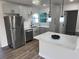 Updated kitchen boasts stainless steel appliances, stylish cabinets, and a bright, inviting atmosphere at 1289 E Hancock Dr, Deltona, FL 32725