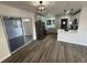 Modern kitchen with stainless steel appliances, updated cabinets, and a stylish breakfast bar at 1289 E Hancock Dr, Deltona, FL 32725