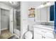 Bright bathroom showcasing modern fixtures, gray tiled shower, and decorative mirror at 1315 Overdale St, Orlando, FL 32825