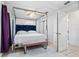 Serene bedroom with canopy bed, plush bedding, and stylish accent furniture at 1315 Overdale St, Orlando, FL 32825