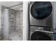 Contemporary laundry room featuring a new washer and dryer, with access to shower at 1315 Overdale St, Orlando, FL 32825