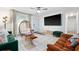 Spacious living room with tile floors, trendy furnishings, and a large flat-screen TV at 1315 Overdale St, Orlando, FL 32825