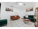 Bright living room with tile flooring, stylish sofas, and a unique live-edge coffee table at 1315 Overdale St, Orlando, FL 32825