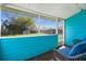 Screened patio with blue decor, offering a serene outdoor living space with a view of the backyard at 1315 Overdale St, Orlando, FL 32825