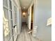 Bright hallway with gray plank flooring and french doors at 14318 Fieldstone Lake Way, Orlando, FL 32824