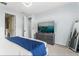 Bright main bedroom featuring a modern TV on a dresser and ensuite access at 14318 Fieldstone Lake Way, Orlando, FL 32824