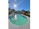 Beautiful backyard pool surrounded by lush landscaping and a secure fence for Gathering enjoyment at 14318 Fieldstone Lake Way, Orlando, FL 32824