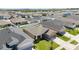 Aerial view of houses in the neighborhood with green lawns at 1575 Eucalyptus Way, Davenport, FL 33837