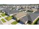Aerial view of houses in neighborhood featuring green lawns and driveways at 1575 Eucalyptus Way, Davenport, FL 33837