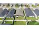 Aerial view of home's backyard featuring patio, grass and privacy fence at 1575 Eucalyptus Way, Davenport, FL 33837