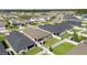 Aerial view of home's backyard with fencing, patio, and lawn at 1575 Eucalyptus Way, Davenport, FL 33837