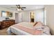 Comfortable bedroom featuring an en suite bathroom, television, and a cozy atmosphere at 1575 Eucalyptus Way, Davenport, FL 33837