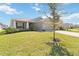 Charming single-story home with well-maintained lawn and landscaping in a quiet neighborhood at 1575 Eucalyptus Way, Davenport, FL 33837