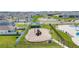 Community playground with slide, covered play area, and green space at 1575 Eucalyptus Way, Davenport, FL 33837