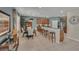 Open concept dining area featuring a breakfast bar, table, and stainless steel appliances at 174 Yellow Snapdragon Dr, Davenport, FL 33837